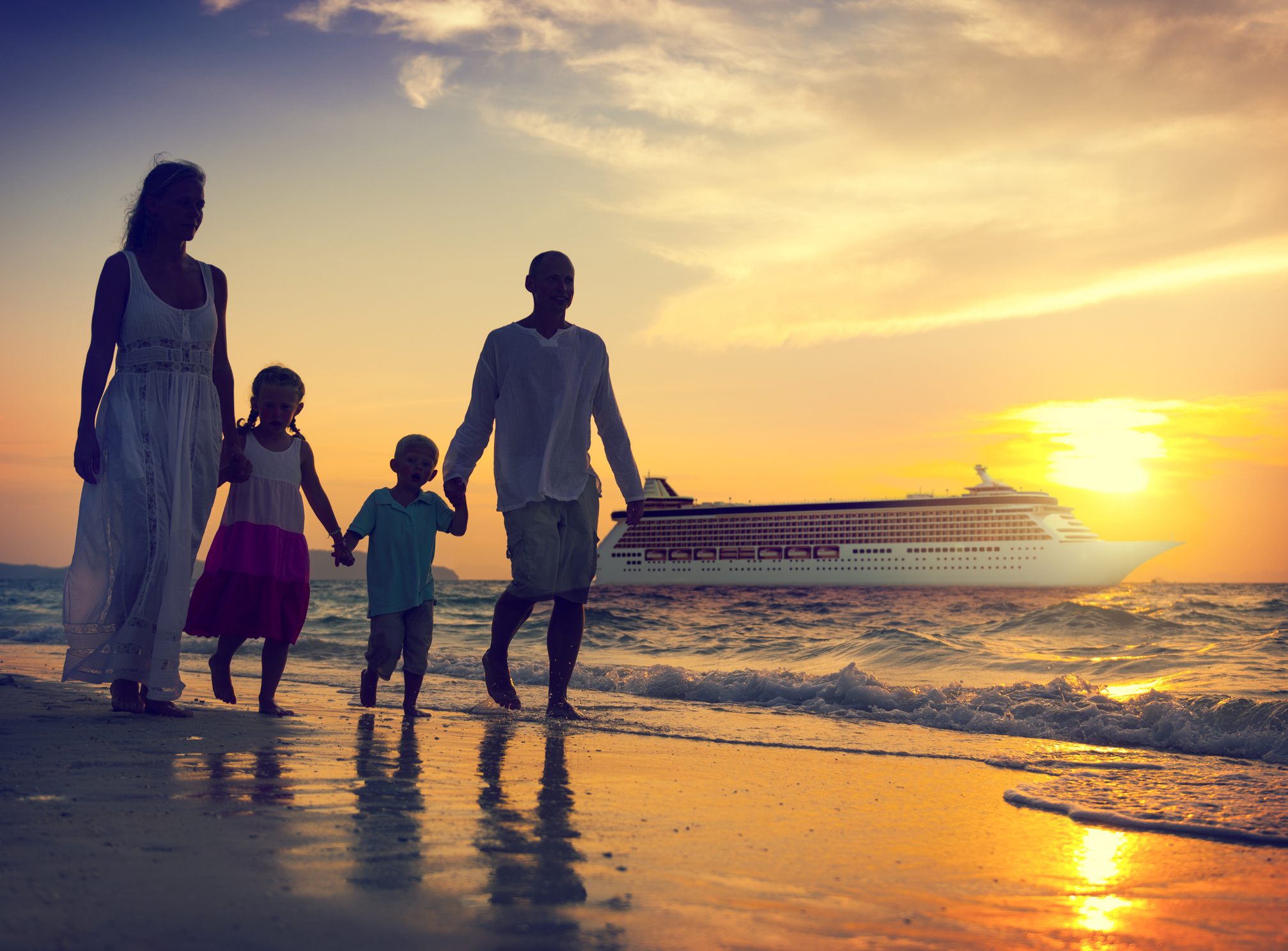 Family on their beach during their luxury cruise