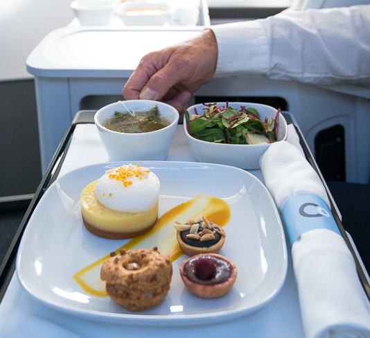 Meal service onboard La Compagnie all-business-class flight.