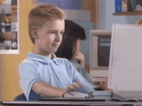 Young boy drags mouse across computer screen, clicking on a button labeled "Short Squeeze."
